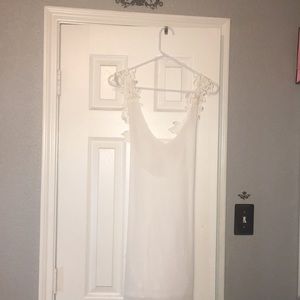 white slip dress with flower embellished straps